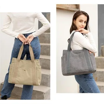 A tote bag 2023 nova moda de grande capacidade, cor sólida, de lona, saco de Mulheres simples e versátil, o trabalho de deslocamento de ombro bolsa